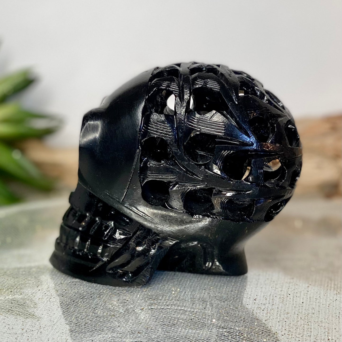 Intricately Carved Black Obsidian Skull: Symbol of Transformation
