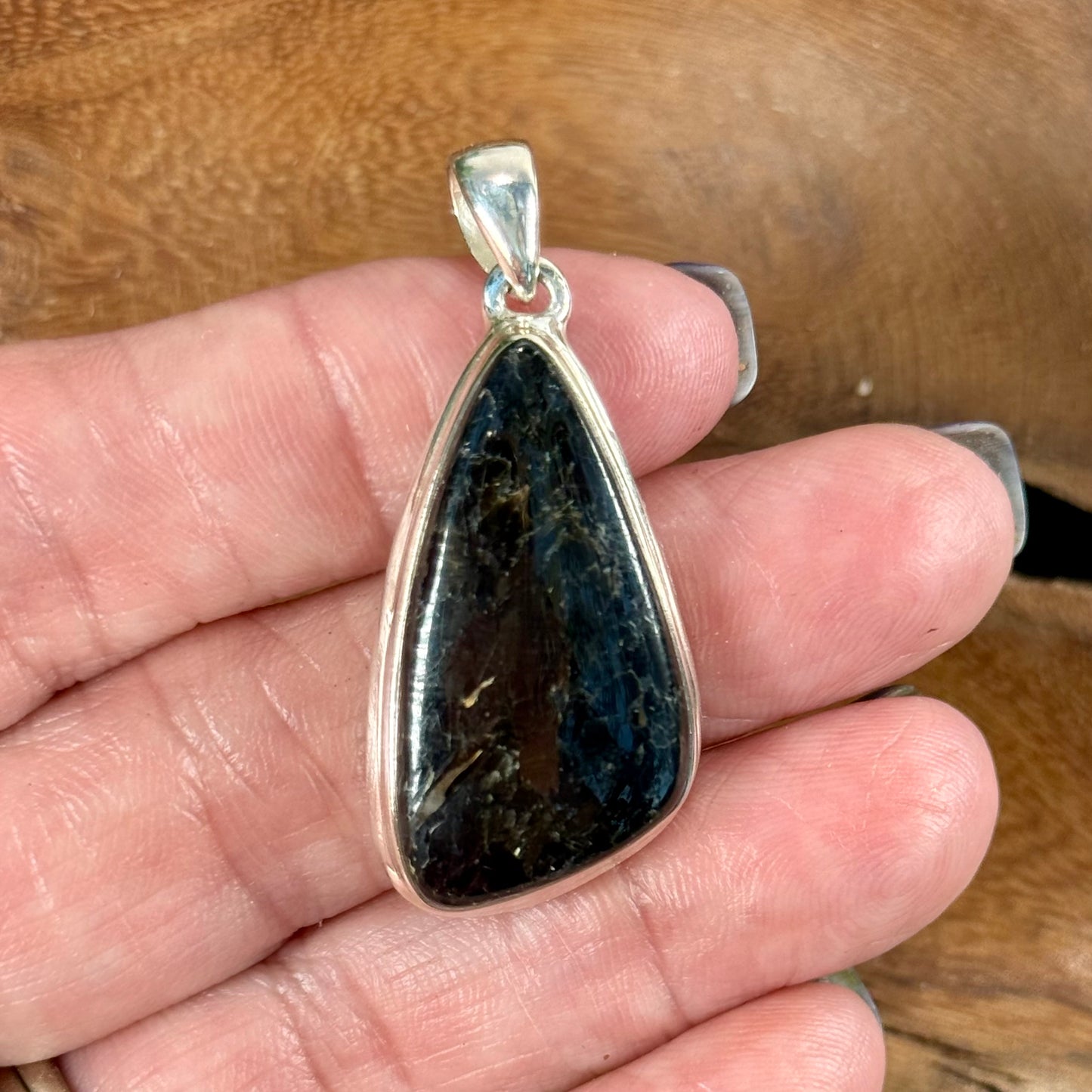 Channel the Earth's Energy with our Nuummite Pendant in Sterling Silver