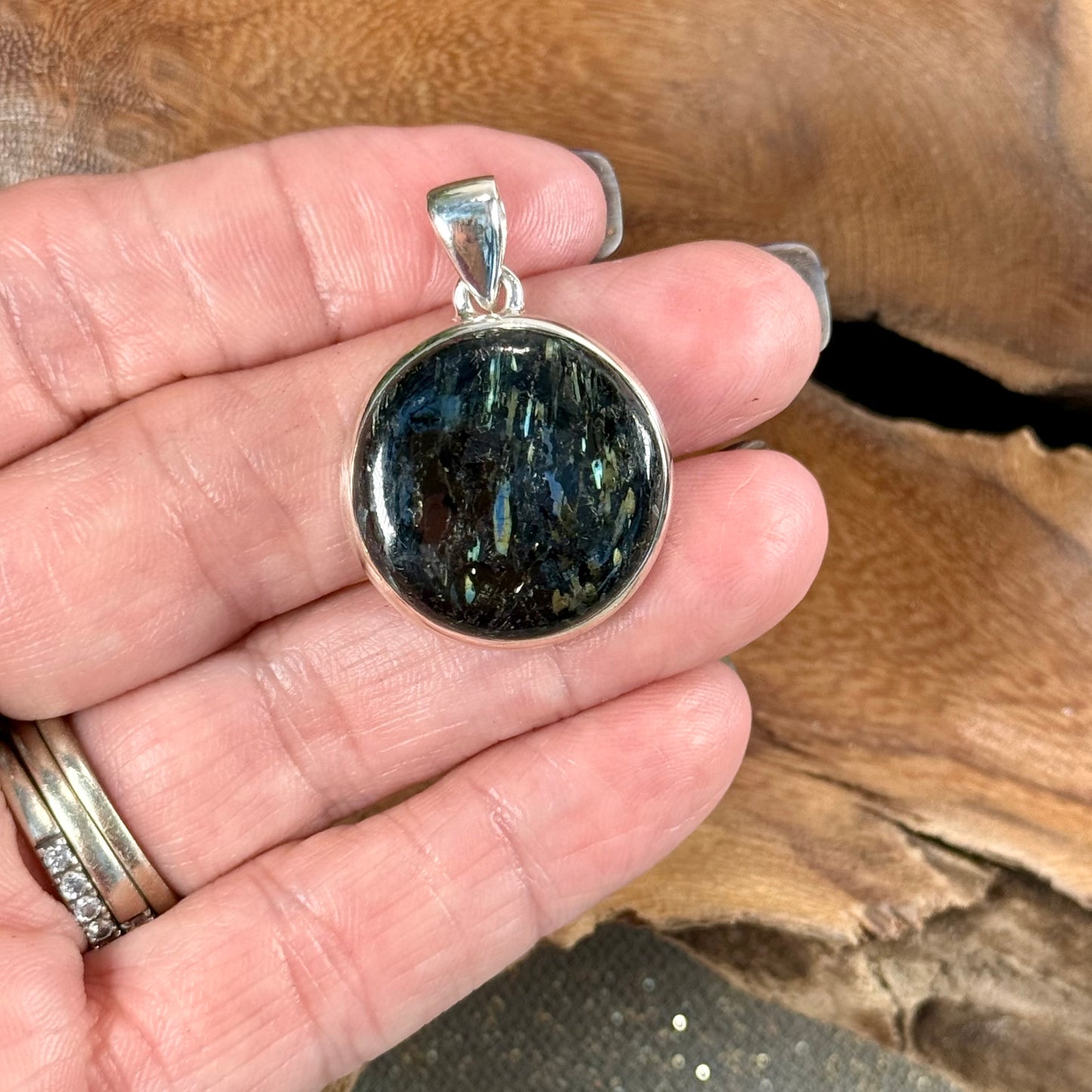 Channel the Earth's Energy with our Nuummite Pendant in Sterling Silver