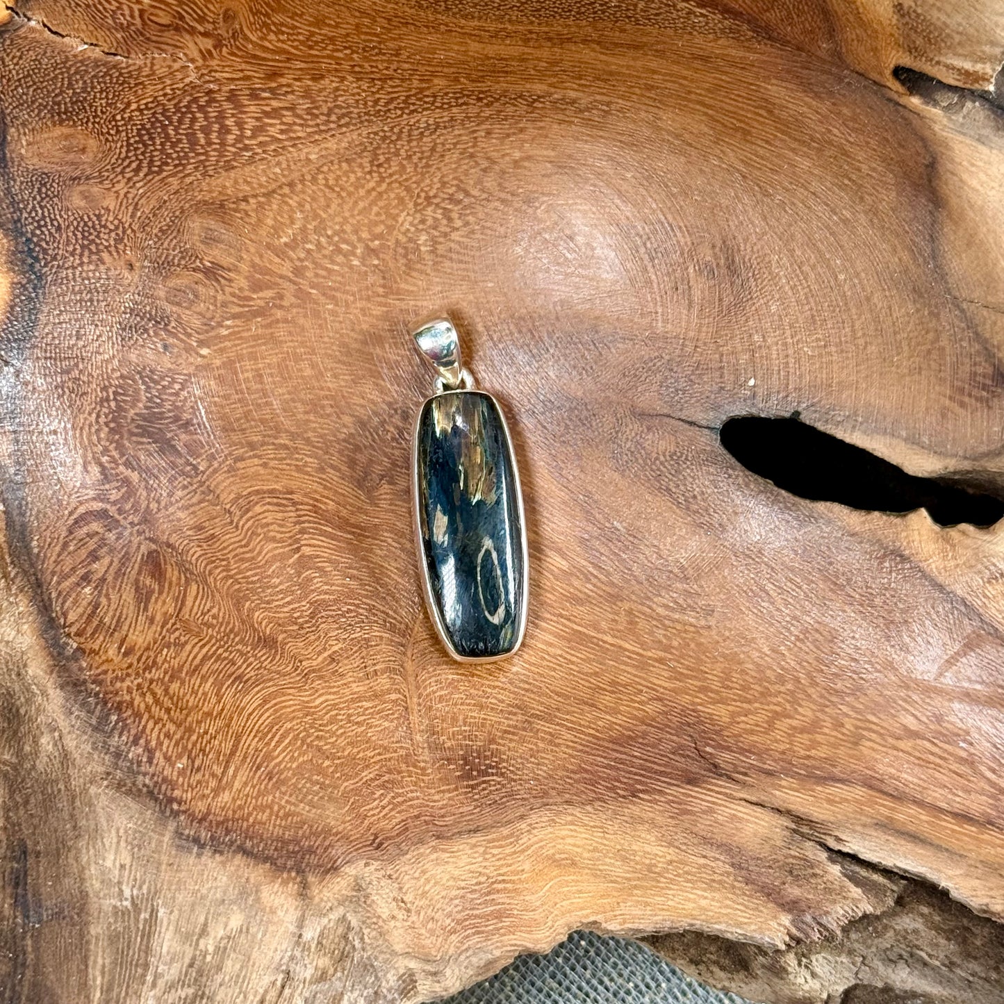 Channel the Earth's Energy with our Nuummite Pendant in Sterling Silver
