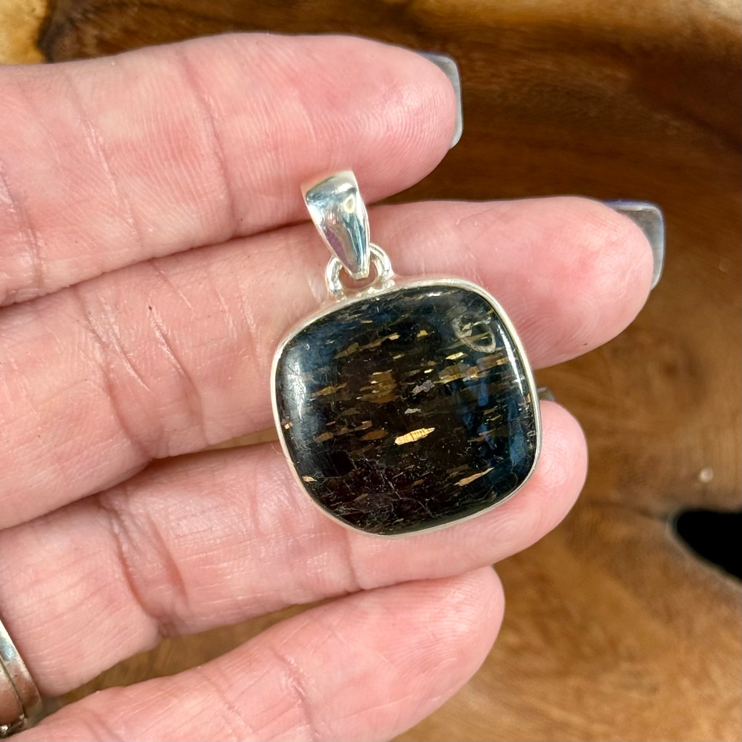 Channel the Earth's Energy with our Nuummite Pendant in Sterling Silver