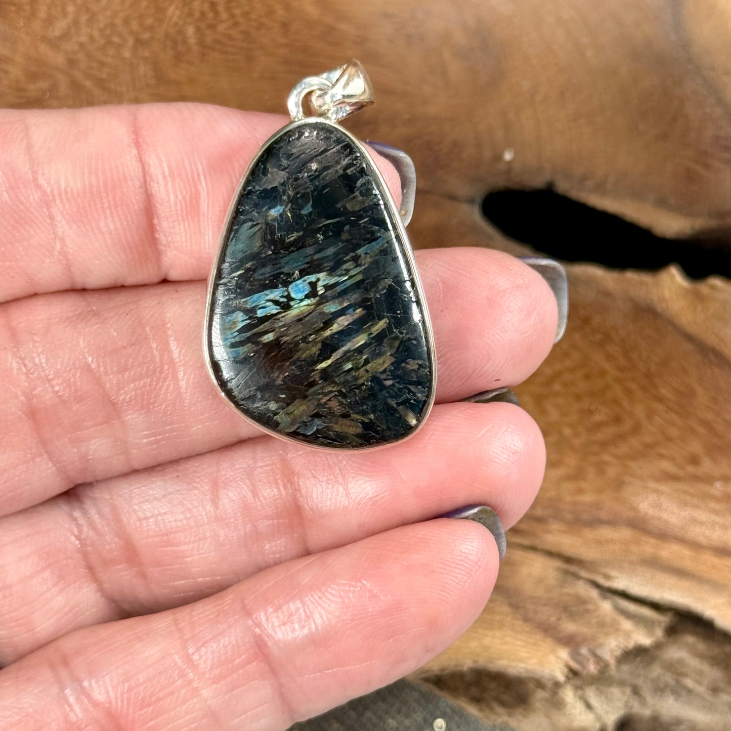 Channel the Earth's Energy with our Nuummite Pendant in Sterling Silver