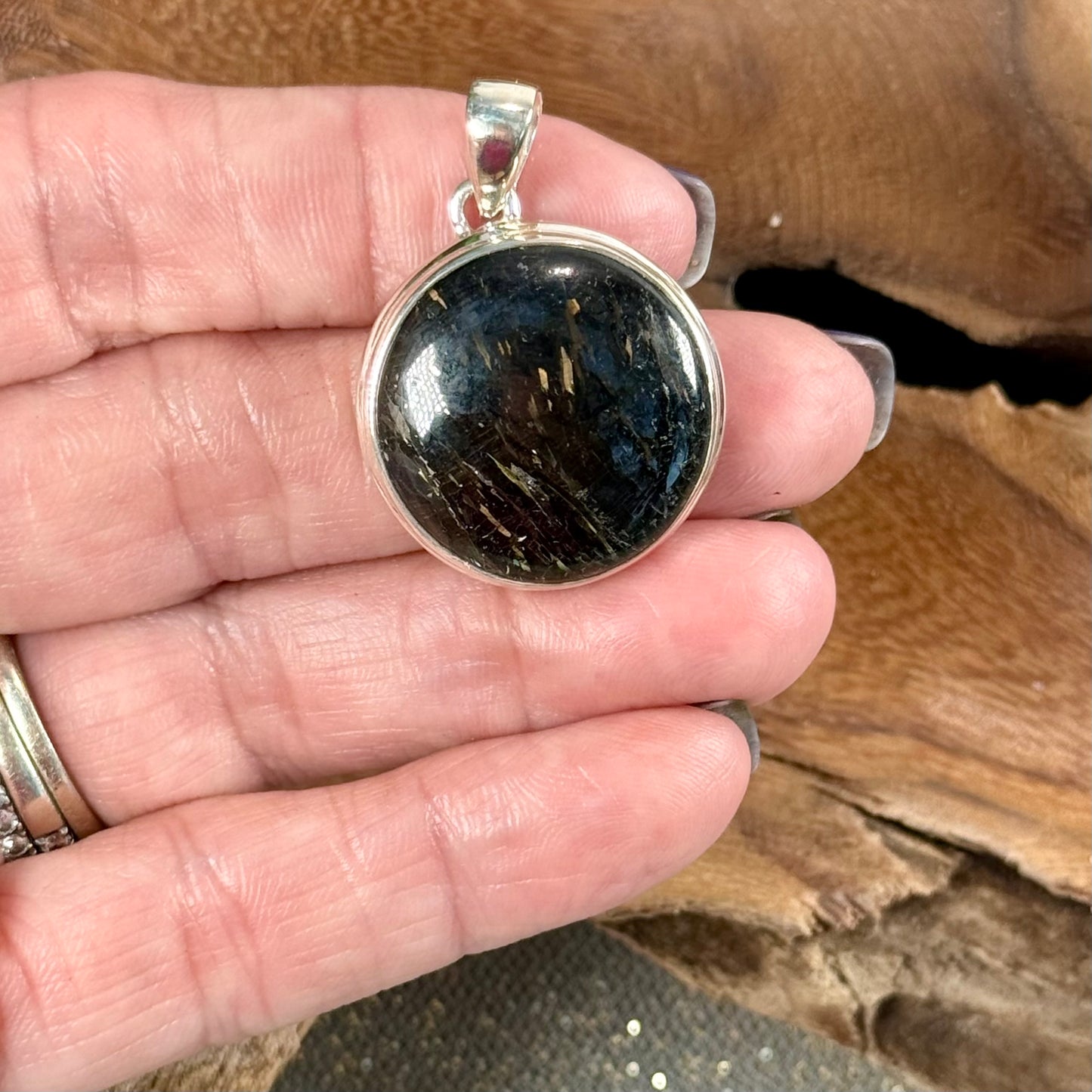 Channel the Earth's Energy with our Nuummite Pendant in Sterling Silver