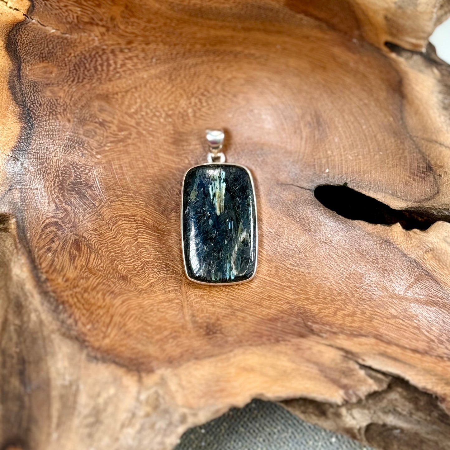 Channel the Earth's Energy with our Nuummite Pendant in Sterling Silver