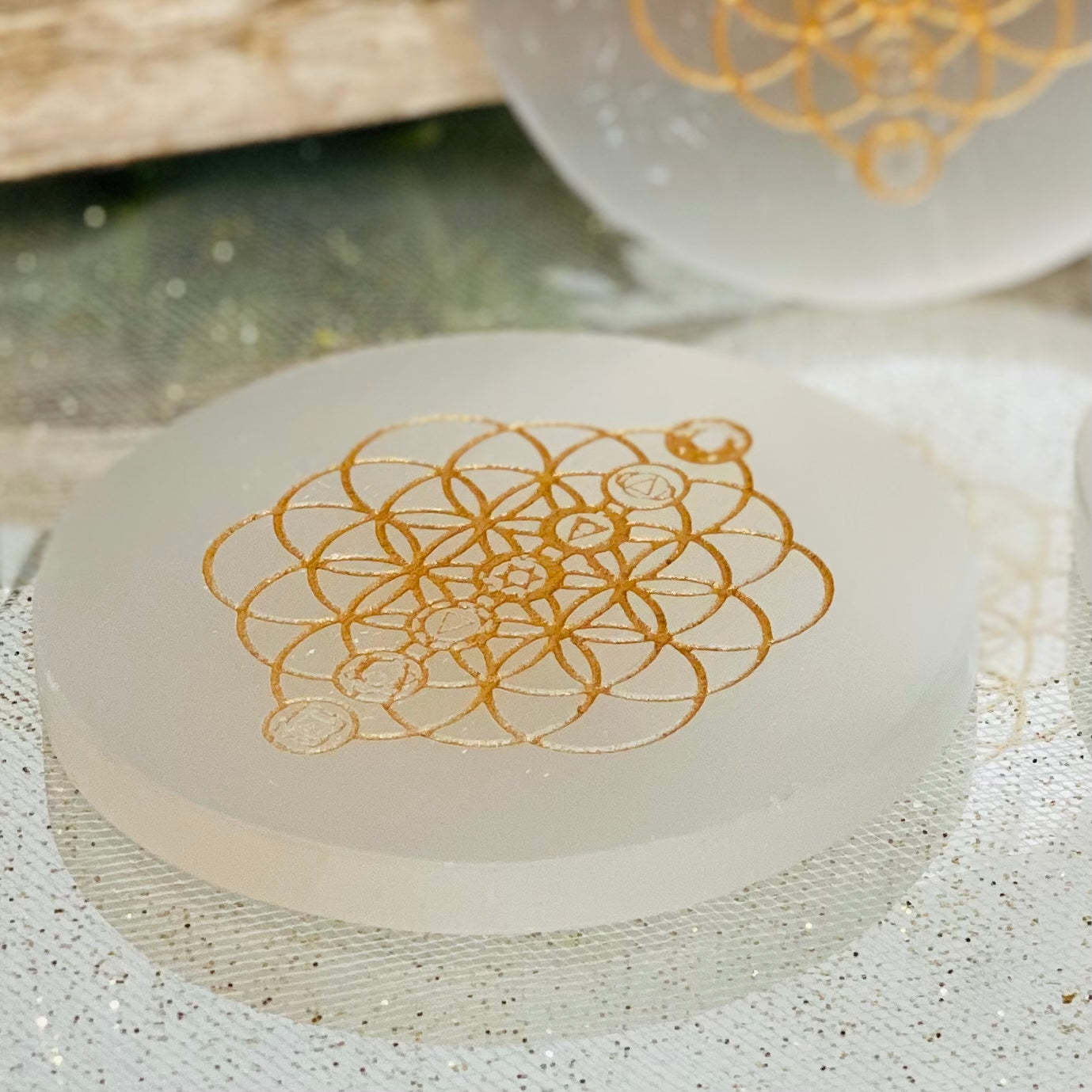 Amplify and Purify Energies with our Chakra Flower of Life Gold Engraved Selenite Charging Plates