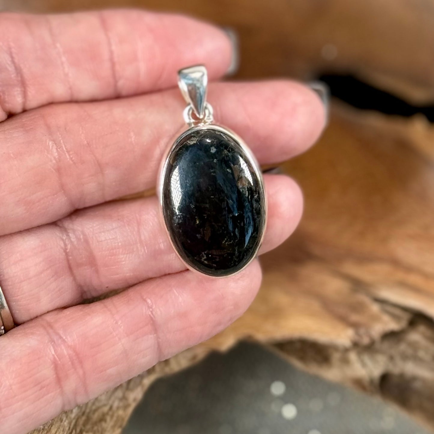 Channel the Earth's Energy with our Nuummite Pendant in Sterling Silver
