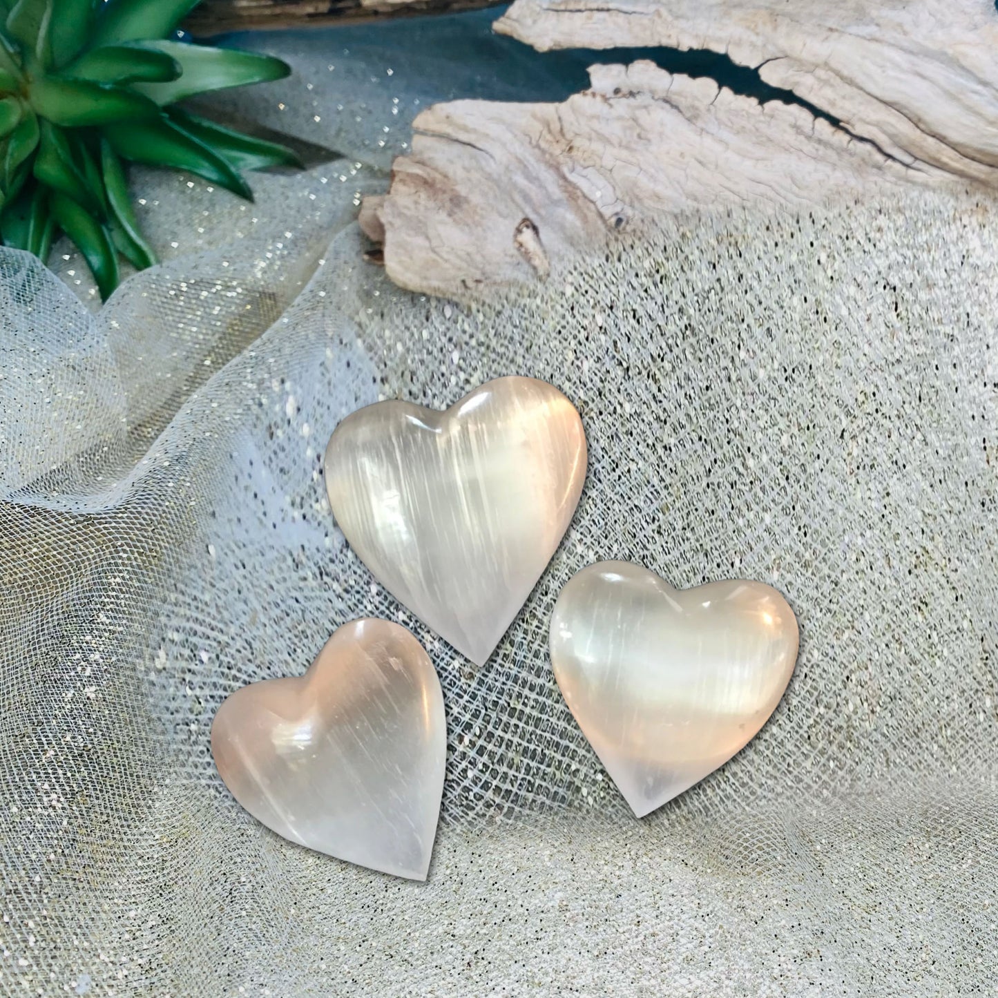 Heartfelt Elegance: Discover the Beauty and Cleansing Power of Large Polished Selenite Carved Hearts