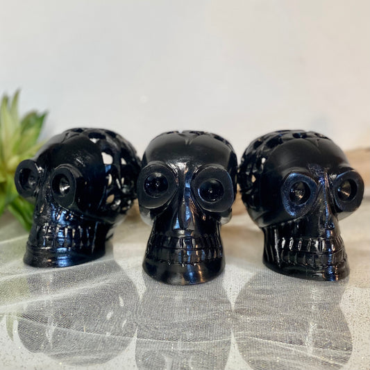 Intricately Carved Black Obsidian Skull: Symbol of Transformation