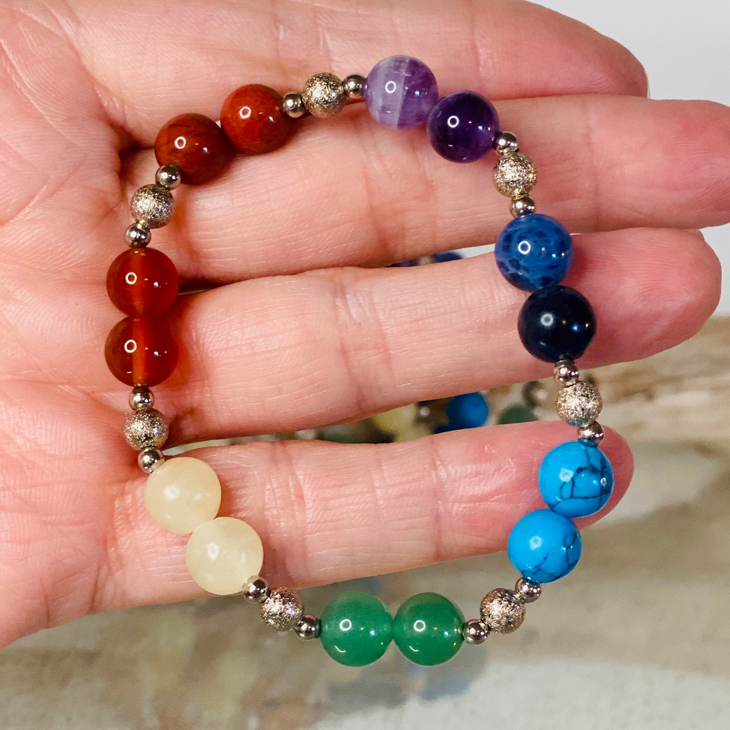 Chakra Balancing Bracelet with Red Jasper, Carnelian, Calcite, Green Aventurine, Blue Howlite, Sodalite, and Amethyst