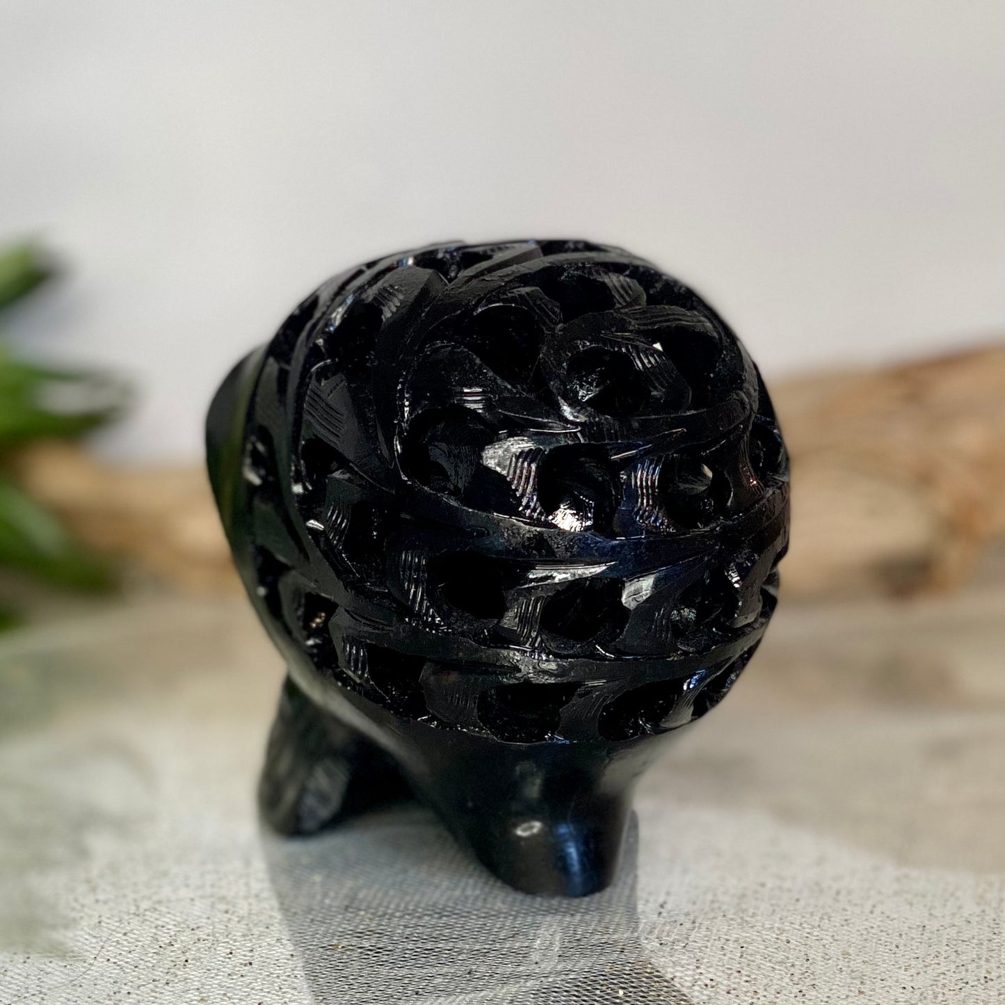 Intricately Carved Black Obsidian Skull: Symbol of Transformation