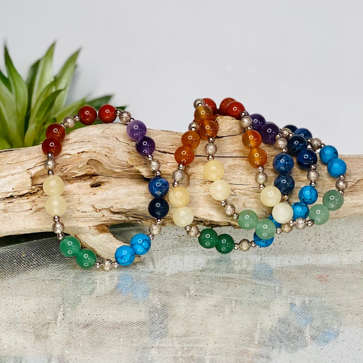 Chakra Balancing Bracelet with Red Jasper, Carnelian, Calcite, Green Aventurine, Blue Howlite, Sodalite, and Amethyst