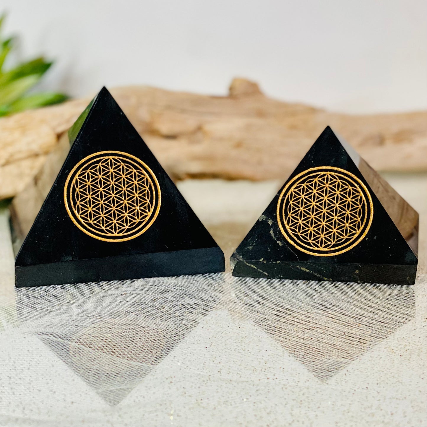 Harmonizing Energies: Shungite Pyramid with Gold Flower of Life Engraving