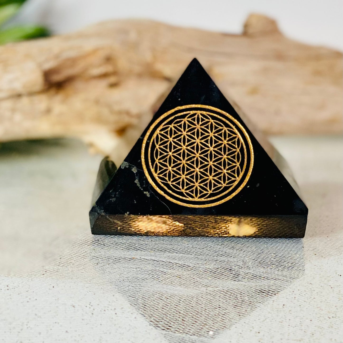 Harmonizing Energies: Shungite Pyramid with Gold Flower of Life Engraving