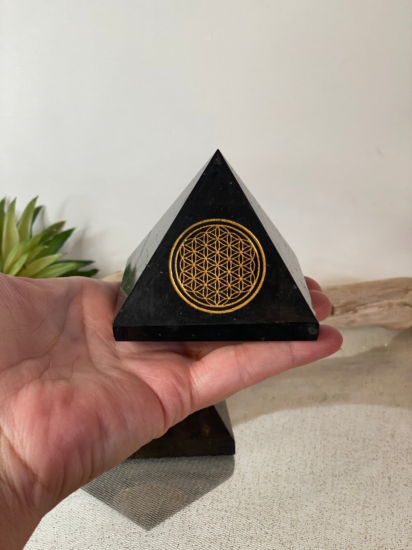 Harmonizing Energies: Shungite Pyramid with Gold Flower of Life Engraving