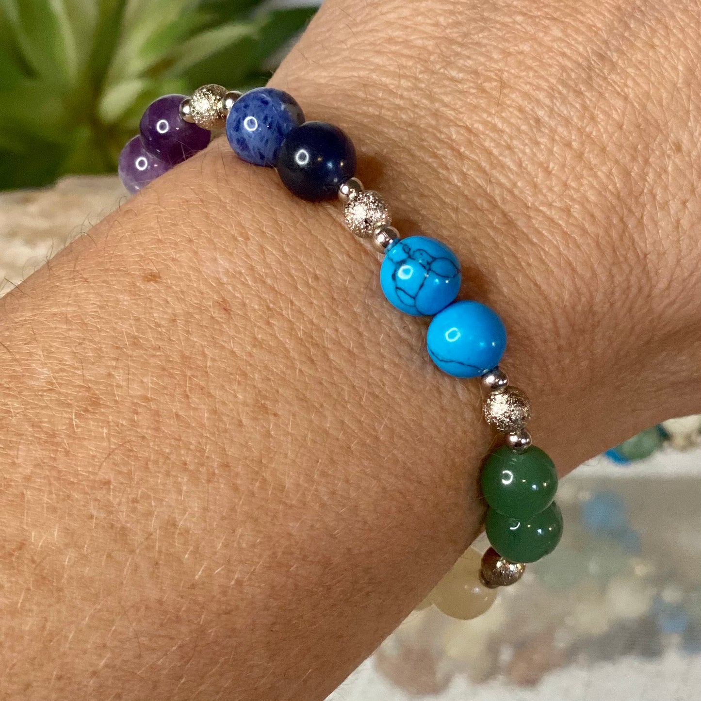 Chakra Balancing Bracelet with Red Jasper, Carnelian, Calcite, Green Aventurine, Blue Howlite, Sodalite, and Amethyst