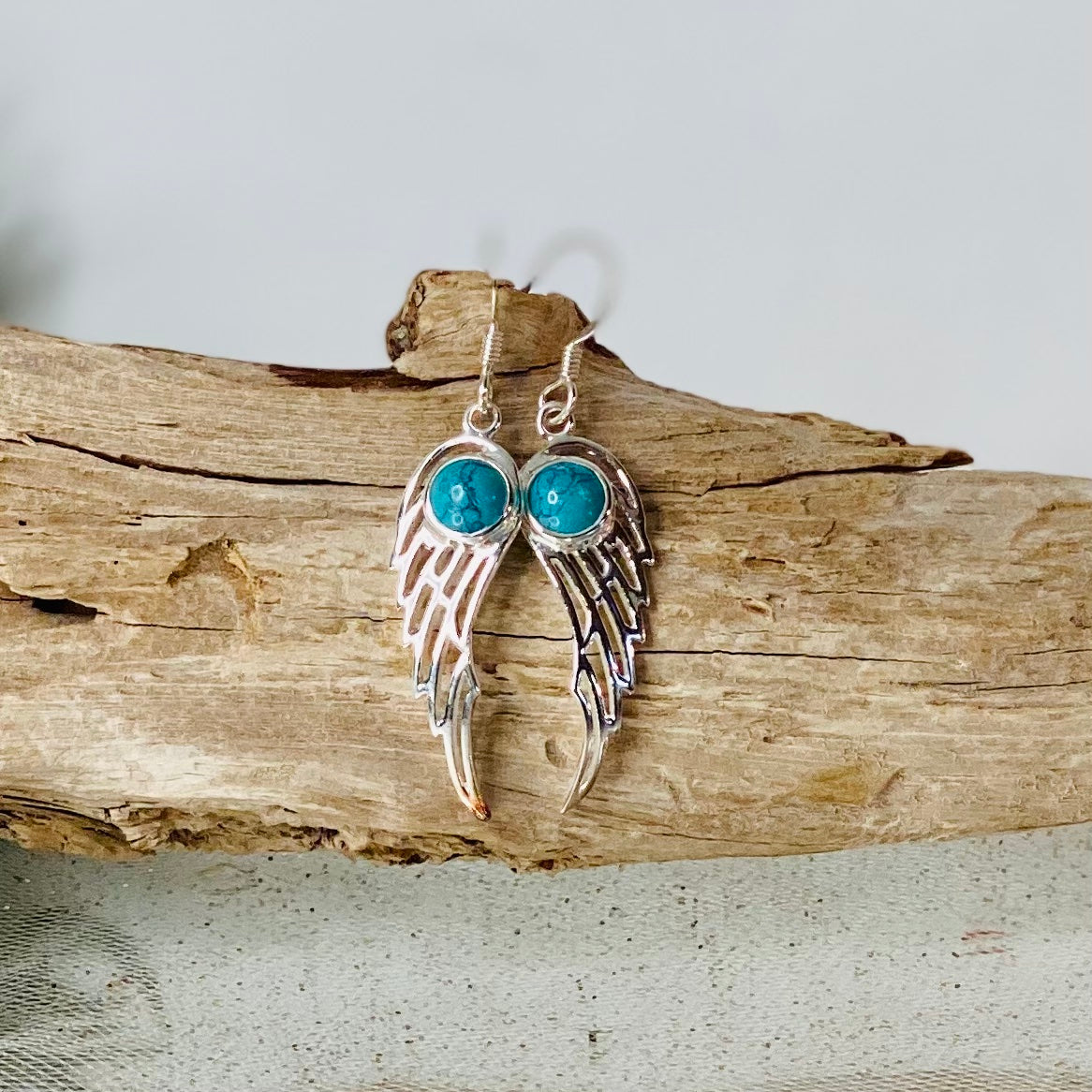 Spiritual Elegance: Sterling Silver Turquoise Angel Wing Earrings