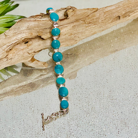 Turquoise Elegance: Sterling Silver Bracelet with 9 Cabochon Stones- CBTS
